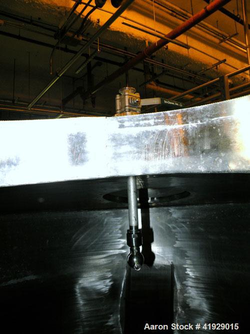 Used Norwalk Tank, 2000 Gallon,  Stainless Steel, Vertical. 76" diameter x 106" straight side, dished top and bottom. Openings top 4" tri-clamp, 4" vent, (2) 18" manway with cover, side 8" drive (cap...