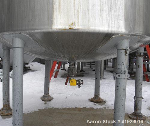 Used Norwalk Tank, 2000 Gallon, 316 Stainless Steel, Vertical. 76" diameter x 106" straight side, dished top and bottom. Top side wall entering angled Lightnin agitator, model N33G-300. 1-1/2" diamet...