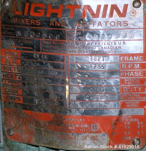 Used Norwalk Tank, 2000 Gallon, 316 Stainless Steel, Vertical. 76" diameter x 106" straight side, dished top and bottom. Top side wall entering angled Lightnin agitator, model N33G-300. 1-1/2" diamet...