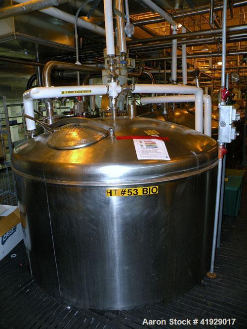 Used Norwalk Tank, 2000 Gallon,  stainless steel, vertical. 76" diameter x 106" straight side, dished top and bottom. Off center top entering angled Lightnin agitator, model N33G-300. 1-1/2" diameter...