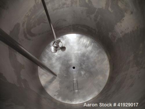 Used Norwalk Tank, 2000 Gallon,  stainless steel, vertical. 76" diameter x 106" straight side, dished top and bottom. Off center top entering angled Lightnin agitator, model N33G-300. 1-1/2" diameter...