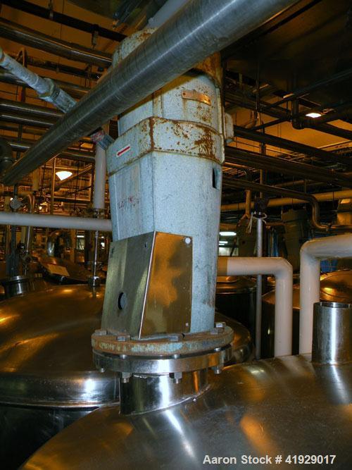 Used Norwalk Tank, 2000 Gallon,  stainless steel, vertical. 76" diameter x 106" straight side, dished top and bottom. Off center top entering angled Lightnin agitator, model N33G-300. 1-1/2" diameter...