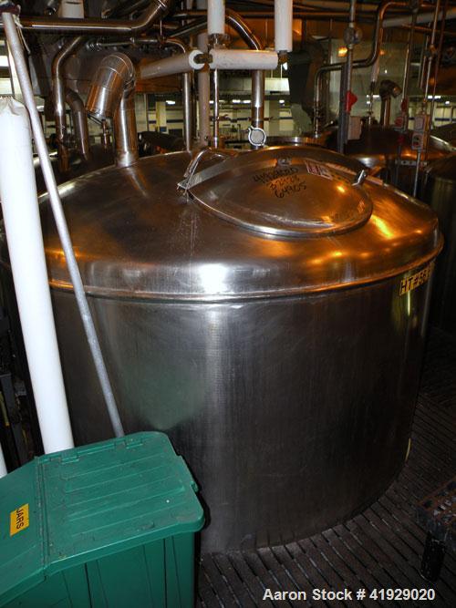 Used Norwalk Tank, 2000 Gallon,  Stainless Steel, Vertical. 76" diameter x 106" straight side, dished top and bottom. Openings top (2) 3" tri-clamp, 4" tri-clamp, 4" vent, 8" drive (capped), 24" manw...