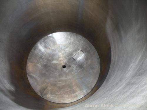 Used Norwalk Tank, 2000 Gallon,  Stainless Steel, Vertical. 76" diameter x 106" straight side, dished top and bottom. Openings top (2) 3" tri-clamp, 4" tri-clamp, 4" vent, 8" drive (capped), 24" manw...