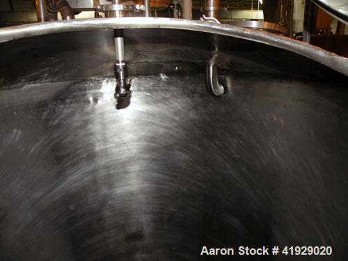 Used Norwalk Tank, 2000 Gallon,  Stainless Steel, Vertical. 76" diameter x 106" straight side, dished top and bottom. Openings top (2) 3" tri-clamp, 4" tri-clamp, 4" vent, 8" drive (capped), 24" manw...