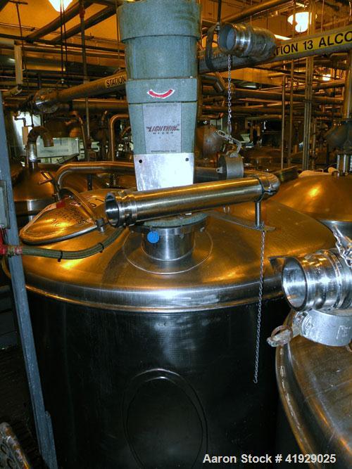 Used Norwalk Tank, 2000 Gallon,  Stainless Steel, Vertical. 76" diameter x 106" straight side, dished top and bottom. Off center top entering Lightnin agitator, model N33G-300. 1-1/2" diameter shaft ...