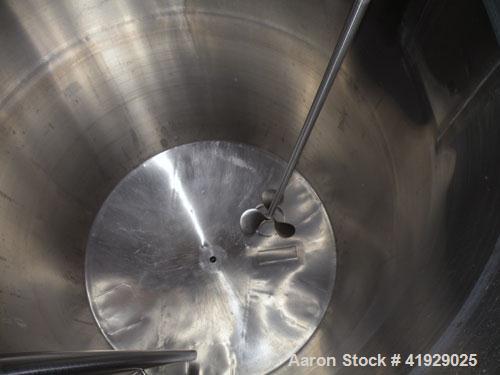 Used Norwalk Tank, 2000 Gallon,  Stainless Steel, Vertical. 76" diameter x 106" straight side, dished top and bottom. Off center top entering Lightnin agitator, model N33G-300. 1-1/2" diameter shaft ...