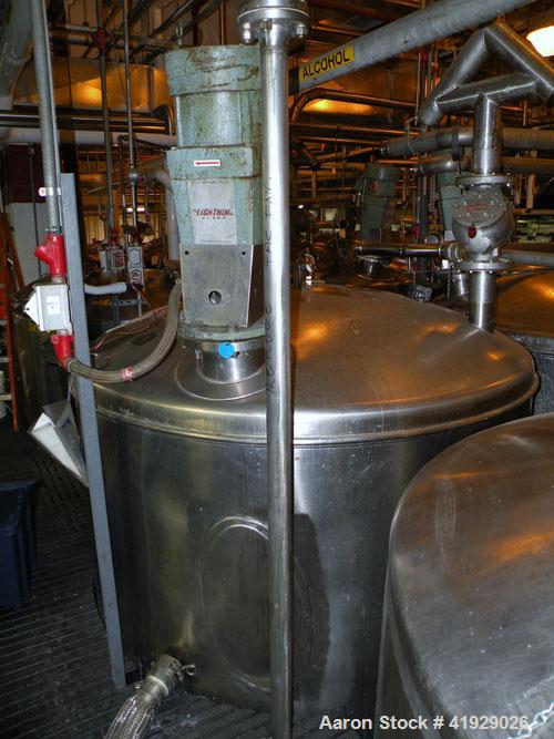 Used Norwalk Tank, 2000 Gallon,  Stainless Steel, Vertical. 76" diameter x 106" straight side, dished top and bottom. Off center top entering Lightnin agitator, model N33G-300. 1-1/2" diameter shaft ...