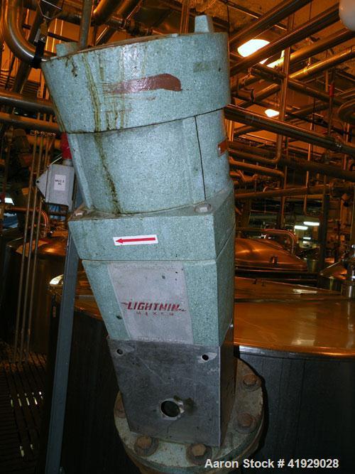 Used Norwalk Tank, 2000 Gallon,  stainless steel, vertical. 76" diameter x 106" straight side, open top with a 1/2 hinged cover, dish bottom. Top side wall entering angled Lightnin agitator, model N3...