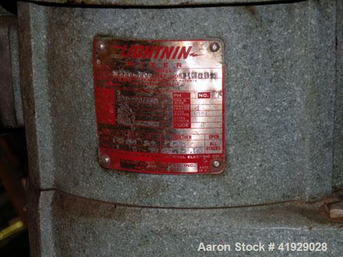 Used Norwalk Tank, 2000 Gallon,  stainless steel, vertical. 76" diameter x 106" straight side, open top with a 1/2 hinged cover, dish bottom. Top side wall entering angled Lightnin agitator, model N3...