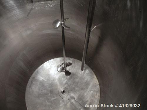 Used Norwalk Tank, 2000 Gallon, 316 Stainless Steel, Vertical. 76" diameter x 106" straight side, dished top and bottom. Off center top entering Lightnin agitator, model N33G-300. 1-1/2" diameter sha...