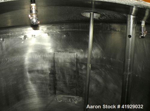 Used Norwalk Tank, 2000 Gallon, 316 Stainless Steel, Vertical. 76" diameter x 106" straight side, dished top and bottom. Off center top entering Lightnin agitator, model N33G-300. 1-1/2" diameter sha...