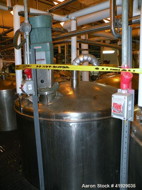 Used Norwalk Tank, 2000 Gallon,  Stainless Steel, Vertical. 76" diameter x 106" straight side, dished top and bottom. Off center top entering Lightnin agitator, model N33G-300. Driven by a 3hp, 3/60/...
