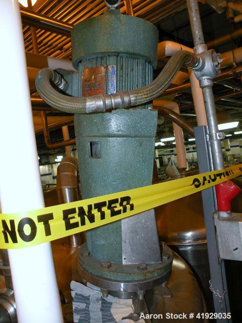 Used Norwalk Tank, 2000 Gallon,  Stainless Steel, Vertical. 76" diameter x 106" straight side, dished top and bottom. Off center top entering Lightnin agitator, model N33G-300. Driven by a 3hp, 3/60/...