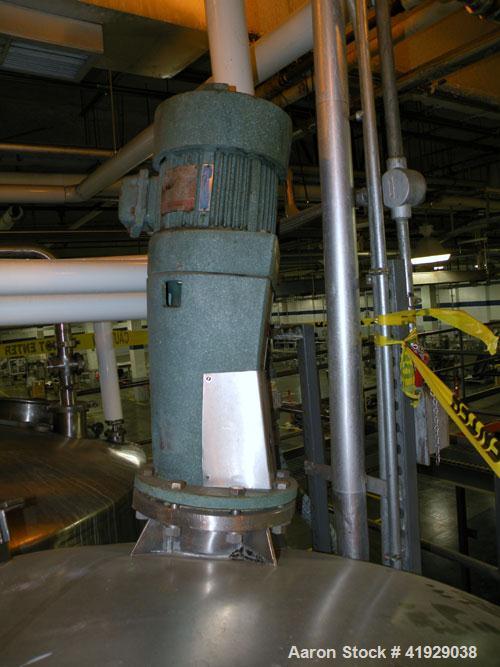 Used Norwalk Tank, 2000 Gallon,  stainless steel, vertical. 76" diameter x 106" straight side, dished top and bottom. Off center top entering Lightnin agitator, model N33G-300. Driven by a 3 hp, 3/60...