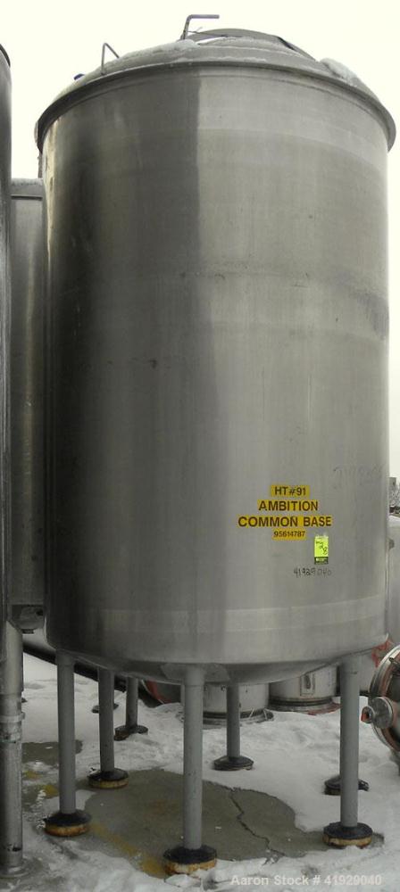 Used Norwalk Tank, 2000 Gallon, 316 Stainless Steel, Vertical. 76" diameter x 106" straight side, dished top and bottom. Top side wall entering angled Lightnin manual variable speed agitator, model N...