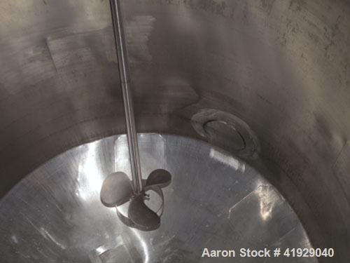 Used Norwalk Tank, 2000 Gallon, 316 Stainless Steel, Vertical. 76" diameter x 106" straight side, dished top and bottom. Top side wall entering angled Lightnin manual variable speed agitator, model N...