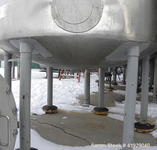 Used Norwalk Tank, 2000 Gallon, 316 Stainless Steel, Vertical. 76" diameter x 106" straight side, dished top and bottom. Top side wall entering angled Lightnin manual variable speed agitator, model N...