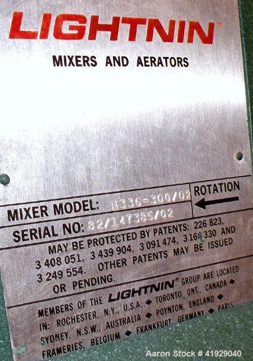Used Norwalk Tank, 2000 Gallon, 316 Stainless Steel, Vertical. 76" diameter x 106" straight side, dished top and bottom. Top side wall entering angled Lightnin manual variable speed agitator, model N...