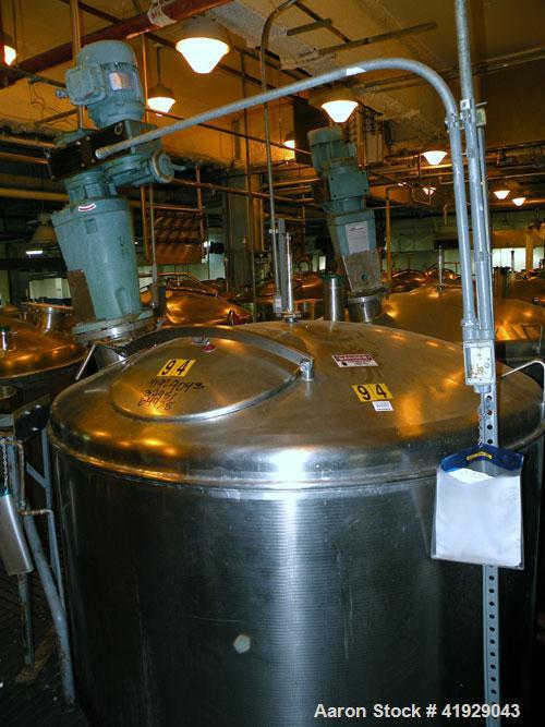 Used Norwalk Tank, 2000 Gallon,  stainless steel, vertical. 76" diameter x 106" straight side, dished top and bottom. Off center top entering angled Lightnin manual variable speed agitator, model N33...