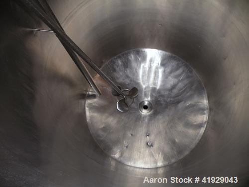 Used Norwalk Tank, 2000 Gallon,  stainless steel, vertical. 76" diameter x 106" straight side, dished top and bottom. Off center top entering angled Lightnin manual variable speed agitator, model N33...
