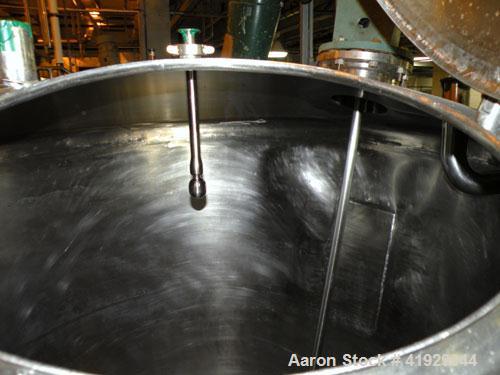 Used Norwalk Tank, 2000 Gallon,  Stainless Steel, Vertical. 76" diameter x 106" straight side, dished top and bottom. Off center top entering angled Lightnin manual variable speed agitator, model N33...