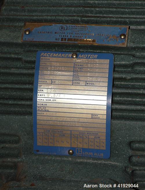 Used Norwalk Tank, 2000 Gallon,  Stainless Steel, Vertical. 76" diameter x 106" straight side, dished top and bottom. Off center top entering angled Lightnin manual variable speed agitator, model N33...