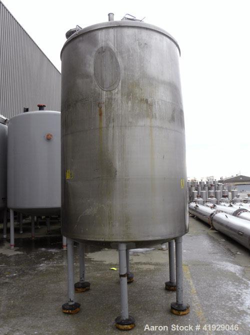 Used Norwalk Tank, 2000 Gallon, 316 Stainless Steel, Vertical. 76" Diameter x 108" straight side, dished top and bottom. Openings: top 3" tri-clamp, 4" tri-clamp, 4" vent, 8" drive (capped), 24" manw...