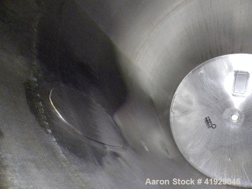 Used Norwalk Tank, 2000 Gallon, 316 Stainless Steel, Vertical. 76" Diameter x 108" straight side, dished top and bottom. Openings: top 3" tri-clamp, 4" tri-clamp, 4" vent, 8" drive (capped), 24" manw...