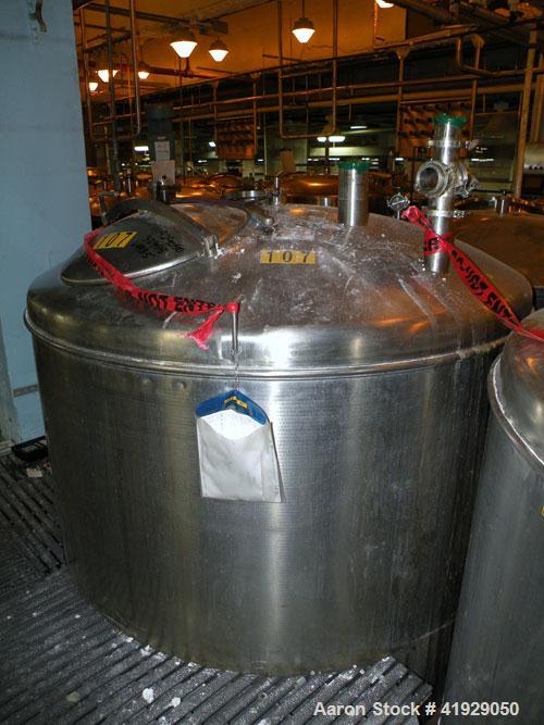Used Norwalk Tank, 2000 Gallon, Stainless Steel, Vertical. 76" Diameter x 106" straight side, dished 304 stainless steel top head, dished bottom. Openings: top 3" tri-clamp, 4" tri-clamp, 4" vent, 8"...