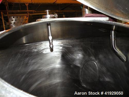 Used Norwalk Tank, 2000 Gallon, Stainless Steel, Vertical. 76" Diameter x 106" straight side, dished 304 stainless steel top head, dished bottom. Openings: top 3" tri-clamp, 4" tri-clamp, 4" vent, 8"...