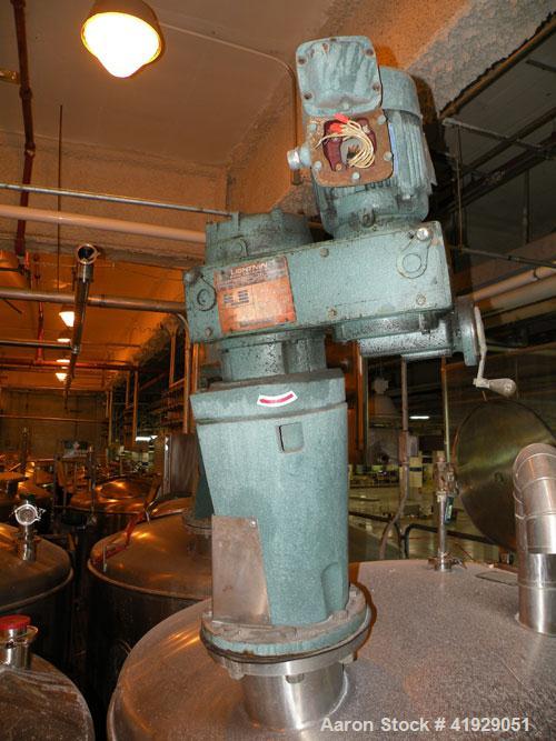 Used Norwalk Tank, 2000 Gallon,  Stainless Steel, Vertical. 76" diameter x 106" straight side, dished top and bottom. Off center top entering angled Lightnin manual variable speed agitator, model N33...