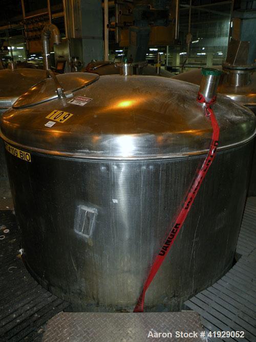 Used Norwalk Tank, 2000 Gallon, stainless steel, vertical. 76" diameter x 106" straight side, dished top and bottom. Openings: top 3", 4", 4" tri-clamp, 4" vent, (2) 18" manway with cover; approximat...