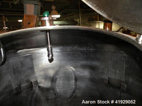 Used Norwalk Tank, 2000 Gallon, stainless steel, vertical. 76" diameter x 106" straight side, dished top and bottom. Openings: top 3", 4", 4" tri-clamp, 4" vent, (2) 18" manway with cover; approximat...