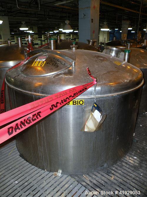 Used Norwalk Tank, 2000 Gallon, stainless steel, vertical. 76" diameter x 106" straight side, dished top and bottom. Openings: top 3" tri-clamp, 4" tri-clamp, 4" vent, 8" drive (capped), 24" manway w...