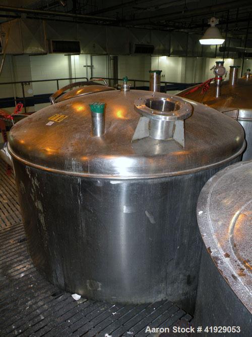 Used Norwalk Tank, 2000 Gallon, stainless steel, vertical. 76" diameter x 106" straight side, dished top and bottom. Openings: top 3" tri-clamp, 4" tri-clamp, 4" vent, 8" drive (capped), 24" manway w...
