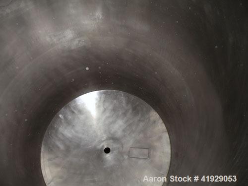 Used Norwalk Tank, 2000 Gallon, stainless steel, vertical. 76" diameter x 106" straight side, dished top and bottom. Openings: top 3" tri-clamp, 4" tri-clamp, 4" vent, 8" drive (capped), 24" manway w...