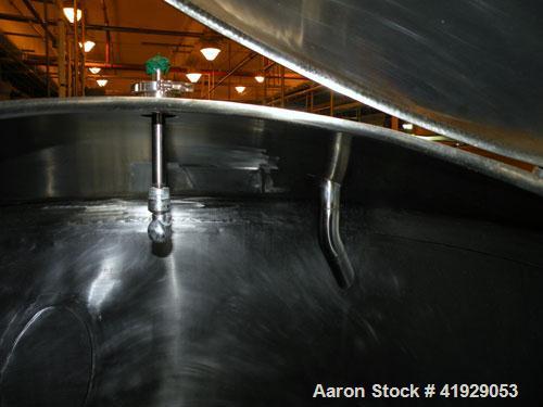Used Norwalk Tank, 2000 Gallon, stainless steel, vertical. 76" diameter x 106" straight side, dished top and bottom. Openings: top 3" tri-clamp, 4" tri-clamp, 4" vent, 8" drive (capped), 24" manway w...