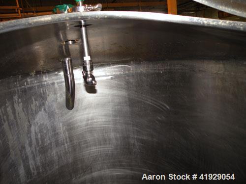 Used Norwalk Tank, 2000 Gallon, stainless steel, vertical. 76" Diameter x 106" straight side, dished top and bottom. Openings: top 3", 4", 4" tri-clamp, 4" vent, (2) 18" manway with cover; approximat...