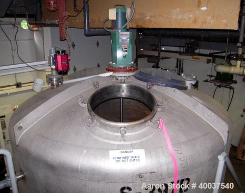 Used Mueller tank, 2200 gallon, stainless steel, vertical. Approximately 96" diameter x 63" straight side, dished top and bottom. Lightnin agitator, model XJC 117, 1 1/2" diameter shaft with (2) 3 bl...