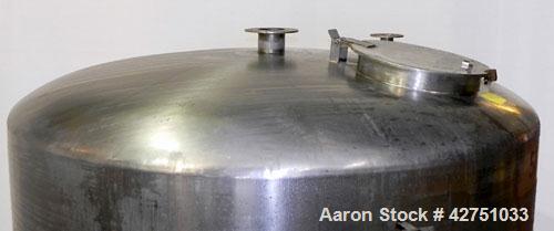 Used Perma-San Tank, 2000 Gallon, Model CVC, 304 Stainless Steel Vertical. 84" Diameter x 80" straight side. Dished top, coned bottom. Openings top (2) 2", 4", 18" man way with cover, side 2". 3" Tri...