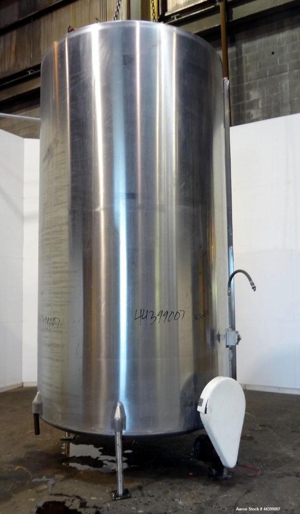 Used Perma-San Tank, 3000 Gallon, 304 Stainless Steel, Vertical.  Approximately 80" diameter x 143" straight side, flat welded top, dished bottom.  Side bottom entering agitator with a 3 blade prop, ...