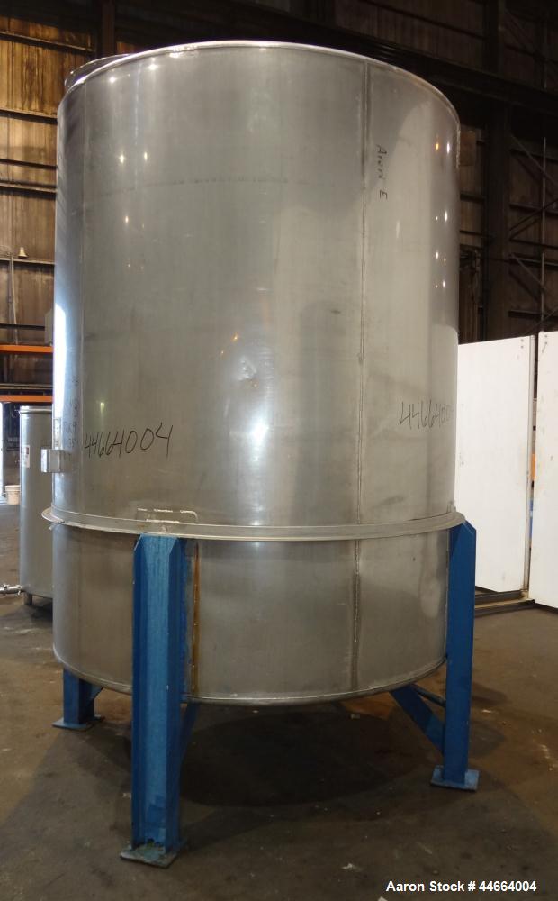 Used Perry Products Tank, 1850 Gallons, 304 Stainless Steel, Vertical. 78" Diameter x 96" straight side, cone top and bottom. Side bottom entering agitator with a (3) blade prop driven by a 5 hp, 3/6...