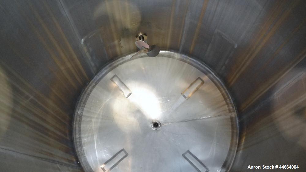 Used Perry Products Tank, 1850 Gallons, 304 Stainless Steel, Vertical. 78" Diameter x 96" straight side, cone top and bottom. Side bottom entering agitator with a (3) blade prop driven by a 5 hp, 3/6...