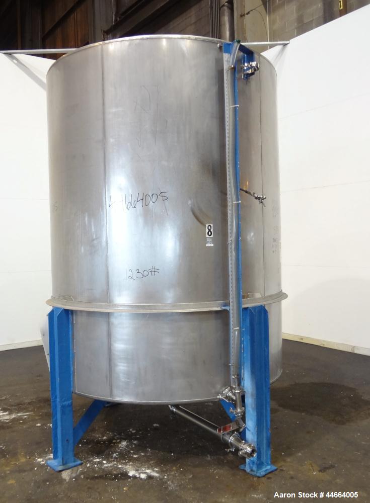 Used Tank, 2000 Gallons, 304 Stainless Steel, Vertical. 78" Diameter X 96" straight side, cone top and bottom. Side bottom entering agitator with a (3) blade prop driven by a 3 hp, 3/60/230/460 volt,...