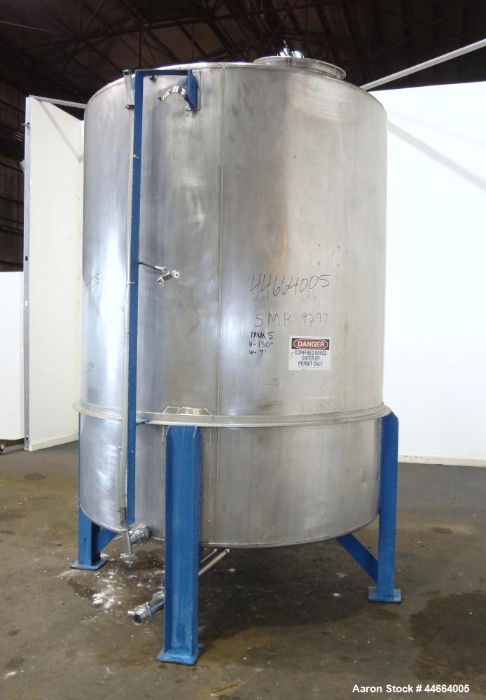 Used Tank, 2000 Gallons, 304 Stainless Steel, Vertical. 78" Diameter X 96" straight side, cone top and bottom. Side bottom entering agitator with a (3) blade prop driven by a 3 hp, 3/60/230/460 volt,...