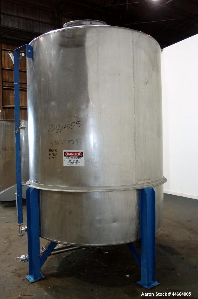 Used Tank, 2000 Gallons, 304 Stainless Steel, Vertical. 78" Diameter X 96" straight side, cone top and bottom. Side bottom entering agitator with a (3) blade prop driven by a 3 hp, 3/60/230/460 volt,...