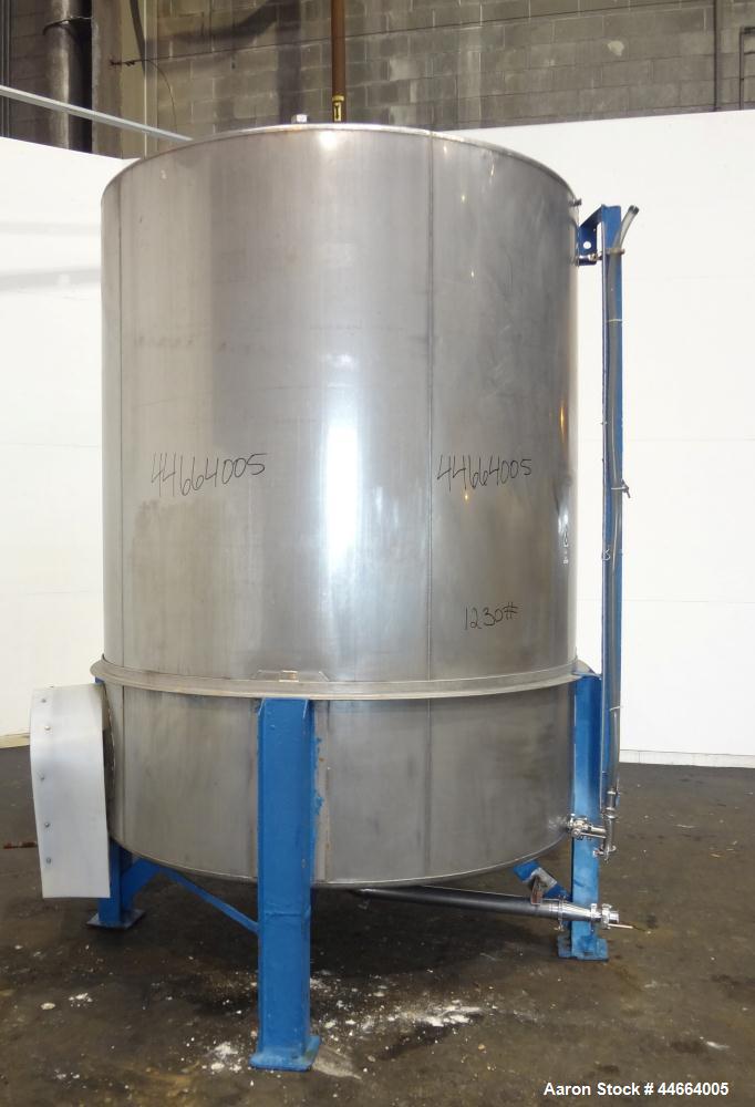 Used Tank, 2000 Gallons, 304 Stainless Steel, Vertical. 78" Diameter X 96" straight side, cone top and bottom. Side bottom entering agitator with a (3) blade prop driven by a 3 hp, 3/60/230/460 volt,...