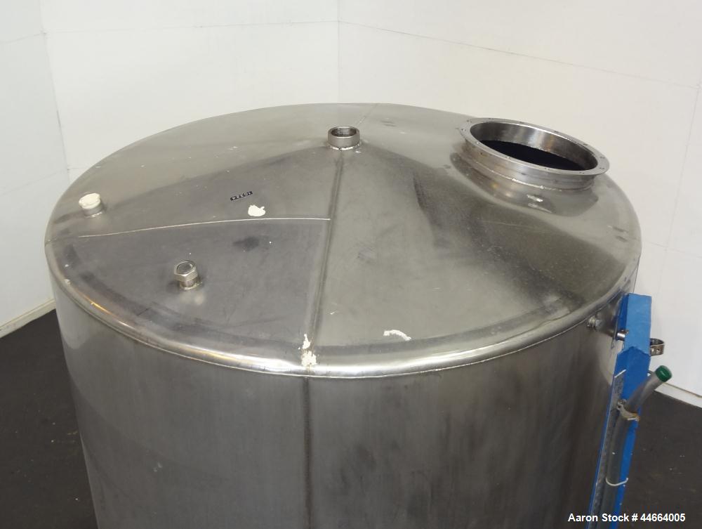 Used Tank, 2000 Gallons, 304 Stainless Steel, Vertical. 78" Diameter X 96" straight side, cone top and bottom. Side bottom entering agitator with a (3) blade prop driven by a 3 hp, 3/60/230/460 volt,...