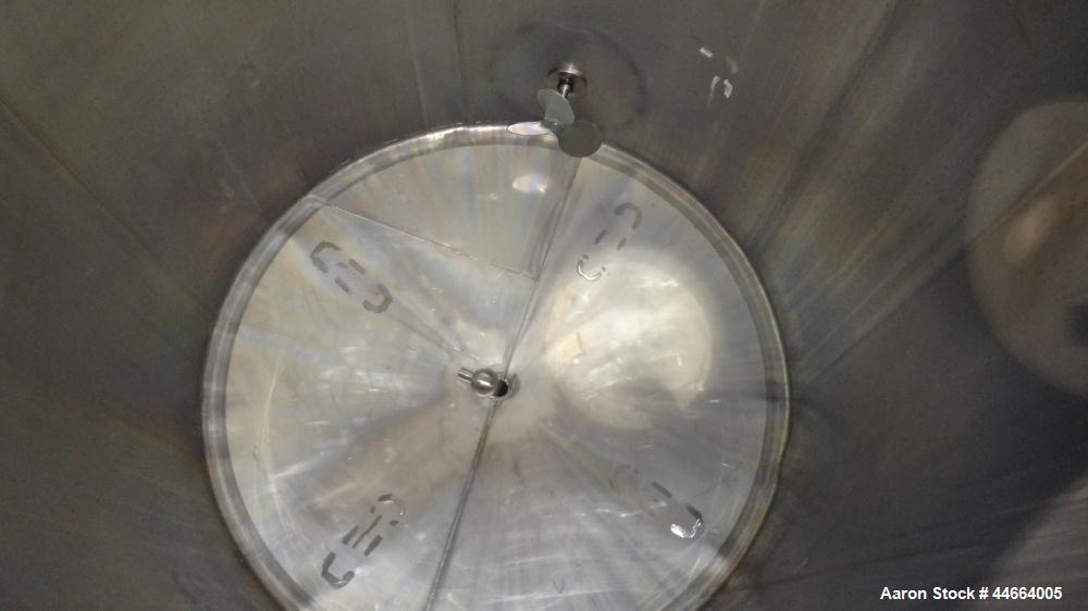 Used Tank, 2000 Gallons, 304 Stainless Steel, Vertical. 78" Diameter X 96" straight side, cone top and bottom. Side bottom entering agitator with a (3) blade prop driven by a 3 hp, 3/60/230/460 volt,...